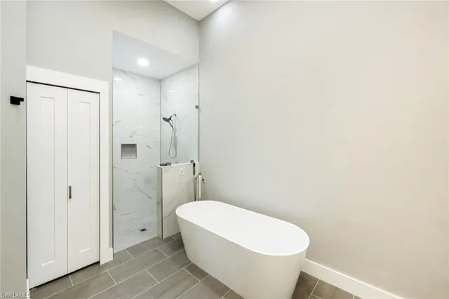 a bathroom with a white toilet and a shower