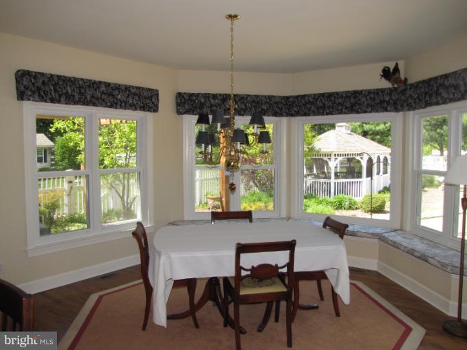 2208 Link Road Silver Spring, MD 20905 - Photo 1 of 30 a dining room with furniture a chandelier and wooden floor