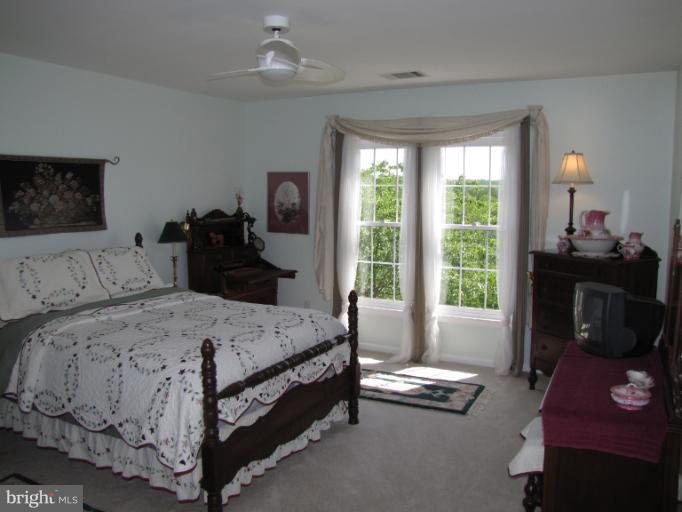 2208 Link Road Silver Spring, MD 20905 - Photo 21 of 30 a bedroom with a bed and a window