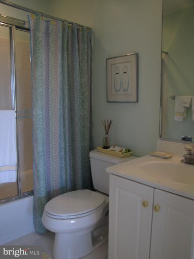 2208 Link Road Silver Spring, MD 20905 - Photo 5 of 30 a bathroom with a granite countertop sink toilet and a mirror