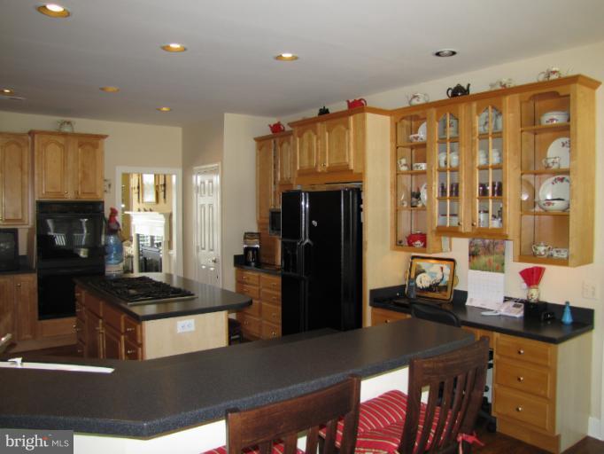 2208 Link Road Silver Spring, MD 20905 - Photo 9 of 30 a kitchen with stainless steel appliances granite countertop a refrigerator and a stove