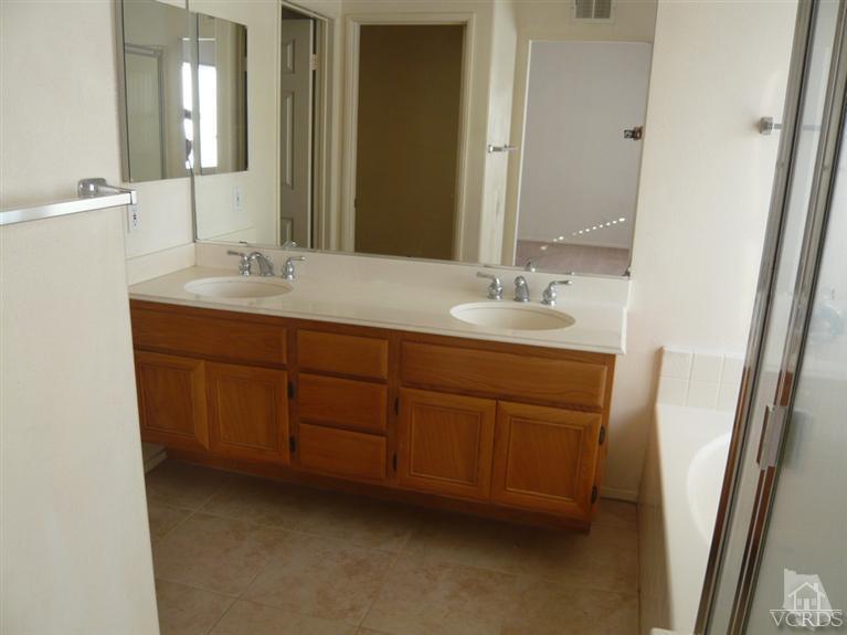 749 Raft Lane Oxnard, CA 93035 - Photo 7 of 14 a bathroom with a double vanity sink and a mirror