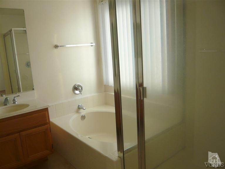 749 Raft Lane Oxnard, CA 93035 - Photo 8 of 14 a bathroom with a bathtub and a sink