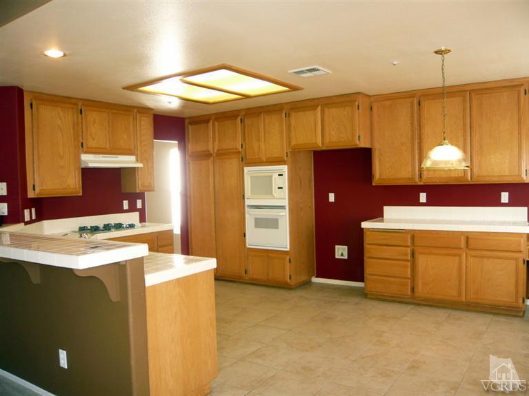 749 Raft Lane Oxnard, CA 93035 - Photo 10 of 14 a kitchen that has a sink and a stove