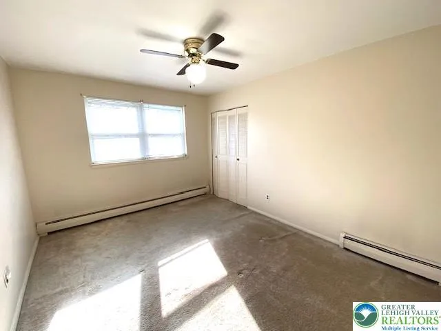 a view of an empty room and window