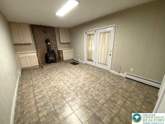 a view of a livingroom with furniture and a window