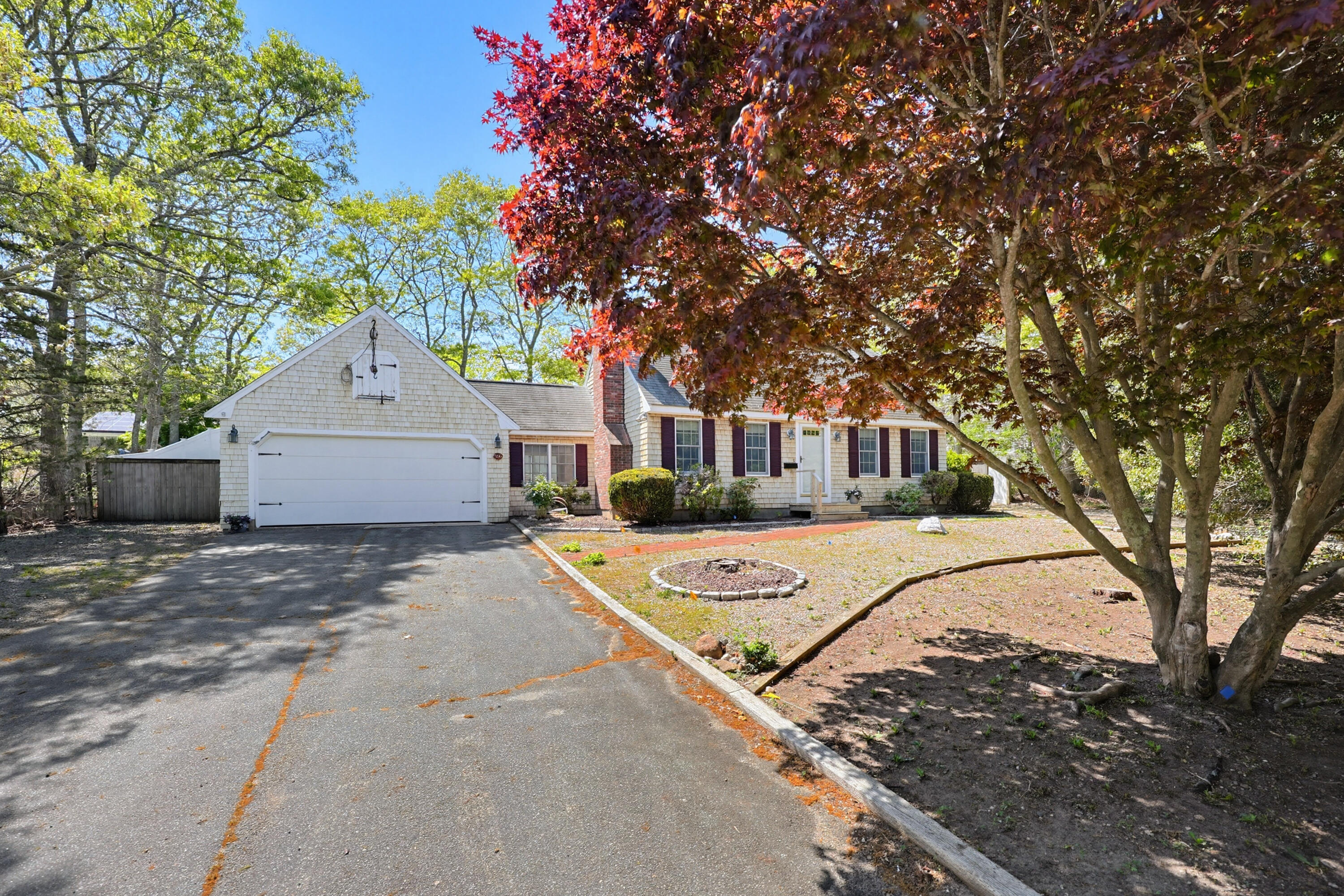 556 Cotuit Road Mashpee, MA 02649 - Photo 42 of 45 a front view of a house with a yard and trees