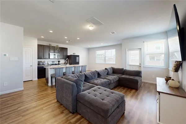 a living room with furniture and a large window