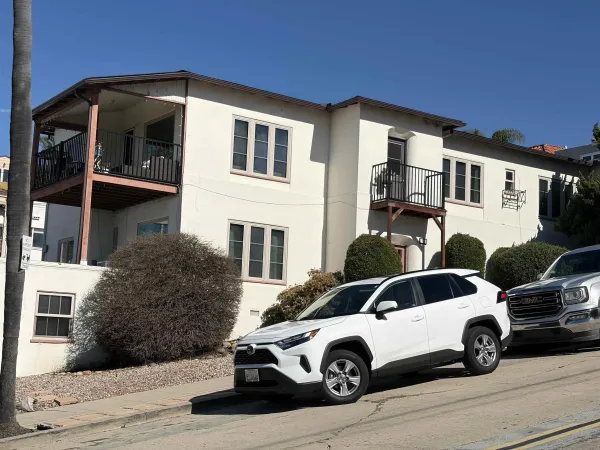 a car parked in front of a house