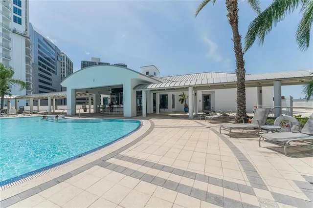 a view of a swimming pool with a patio