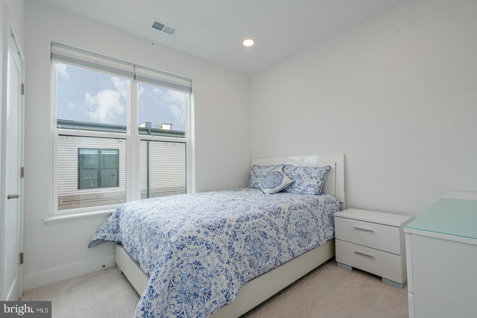 5345 Zenith Overlook Bethesda, MD 20816 - Photo 47 of 53 a bedroom with a bed and large window