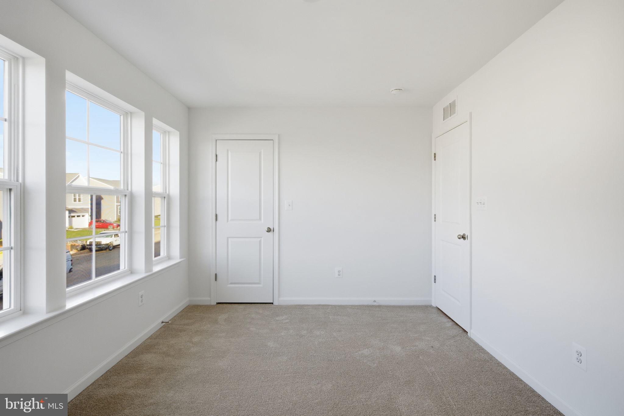 Tbb Tbb Outrigger Road, Unit WEXFORD Inwood, WV 25428 - Photo 19 of 34 a view of an empty room with a window