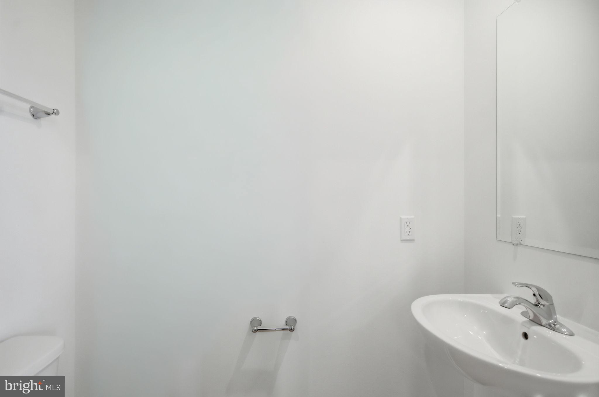 Tbb Tbb Outrigger Road, Unit WEXFORD Inwood, WV 25428 - Photo 21 of 34 a bathroom with a sink and a mirror