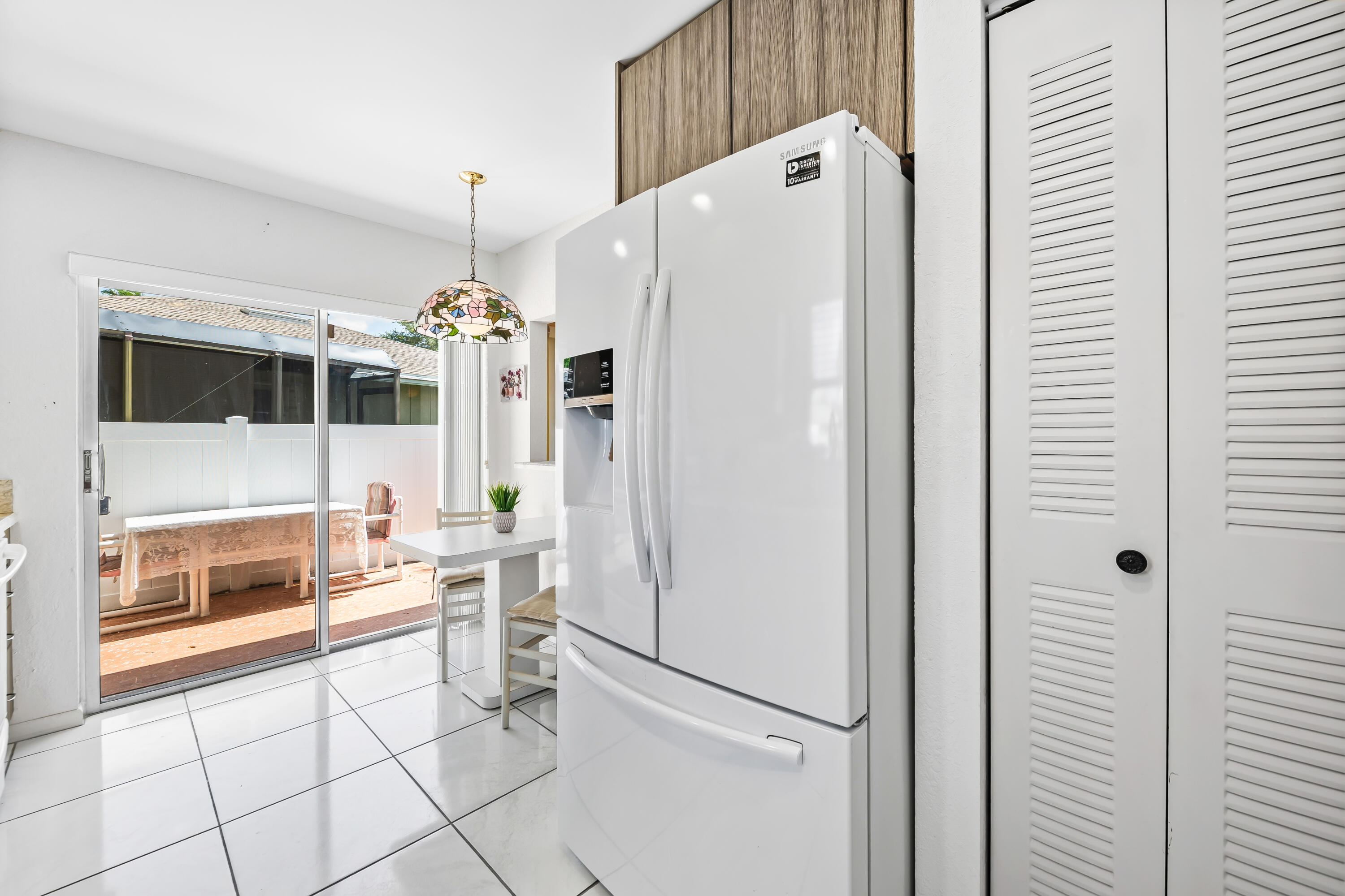 18762 Candlewick Drive Boca Raton, FL 33496 - Photo 10 of 52 a white refrigerator freezer sitting inside of a kitchen