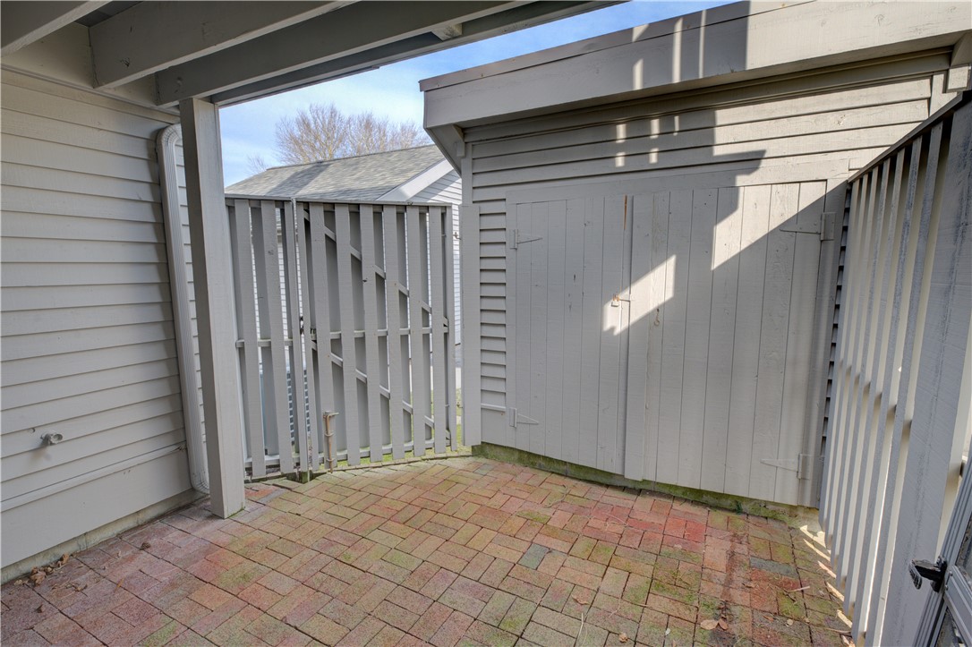 1125 Point Judith Road, Unit A9 Narragansett, RI 02882 - Photo 12 of 18 Enclosed Patio off Bedroom #2 (with storage shed)