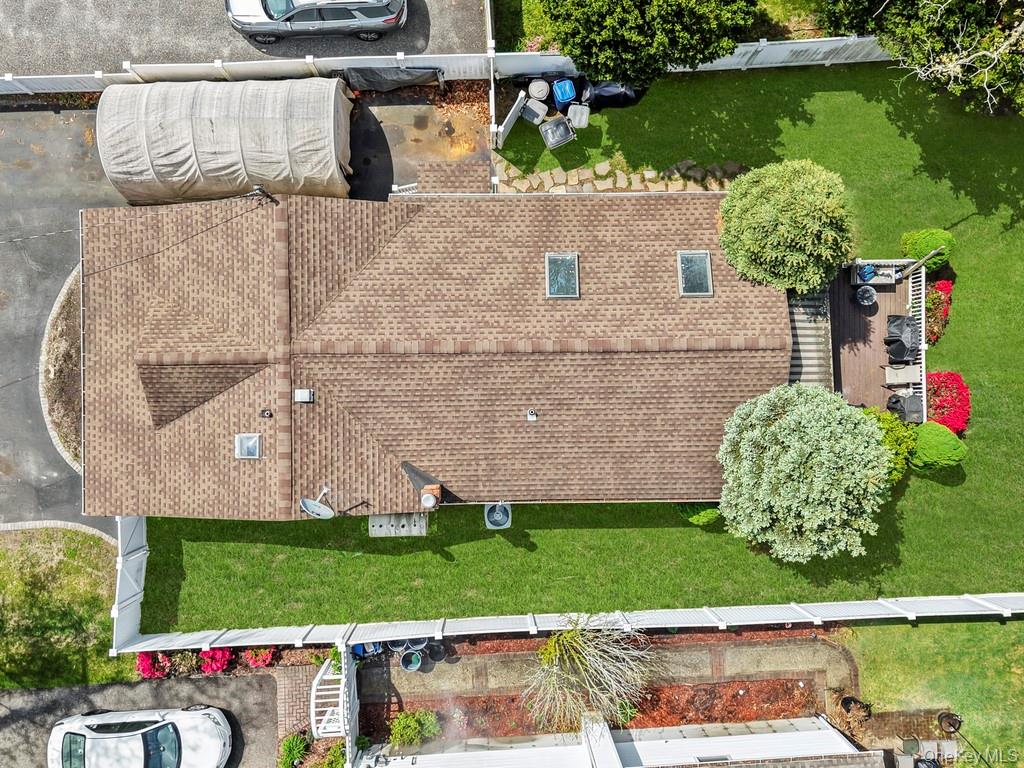164 Dare Road Selden, NY 11784 - Photo 5 of 20 an aerial view of a house with a garden and lake view