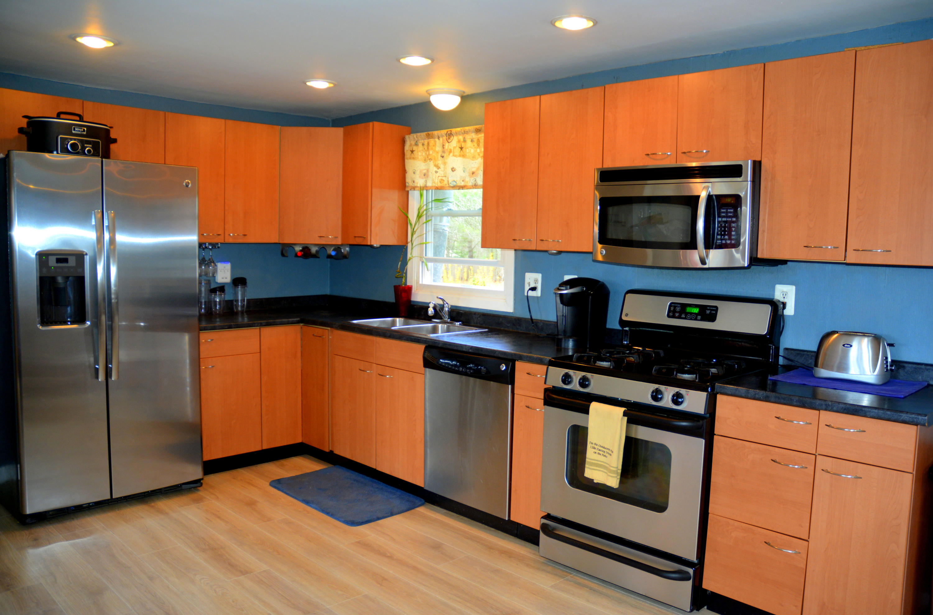 61 Papermill Road West Wareham, MA 02576 - Photo 5 of 20 a kitchen with stainless steel appliances granite countertop a stove a sink and a microwave