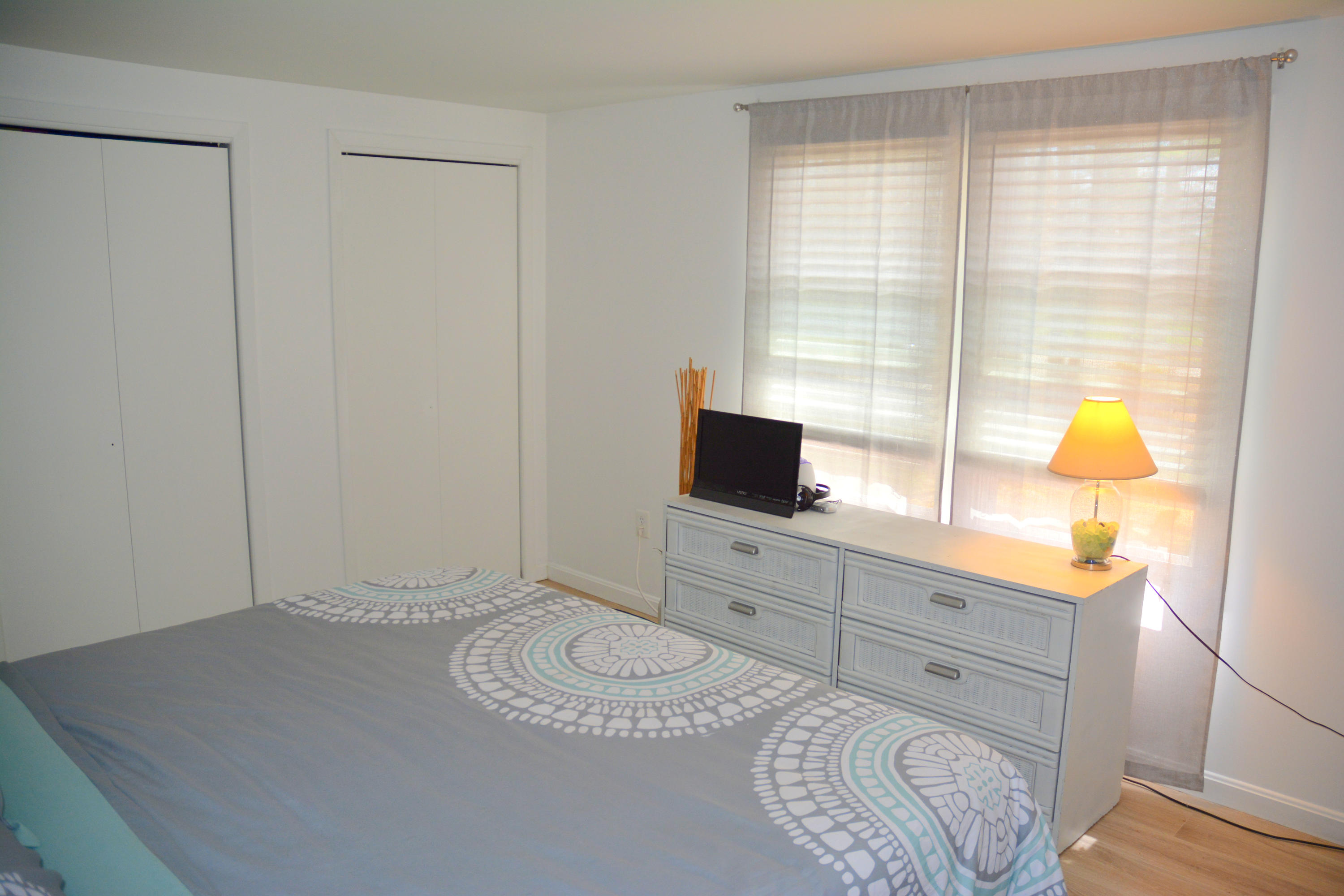 61 Papermill Road West Wareham, MA 02576 - Photo 9 of 20 a bedroom with a bed and a flat screen tv