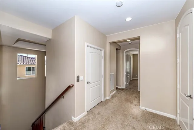 a view of a hallway with closet area