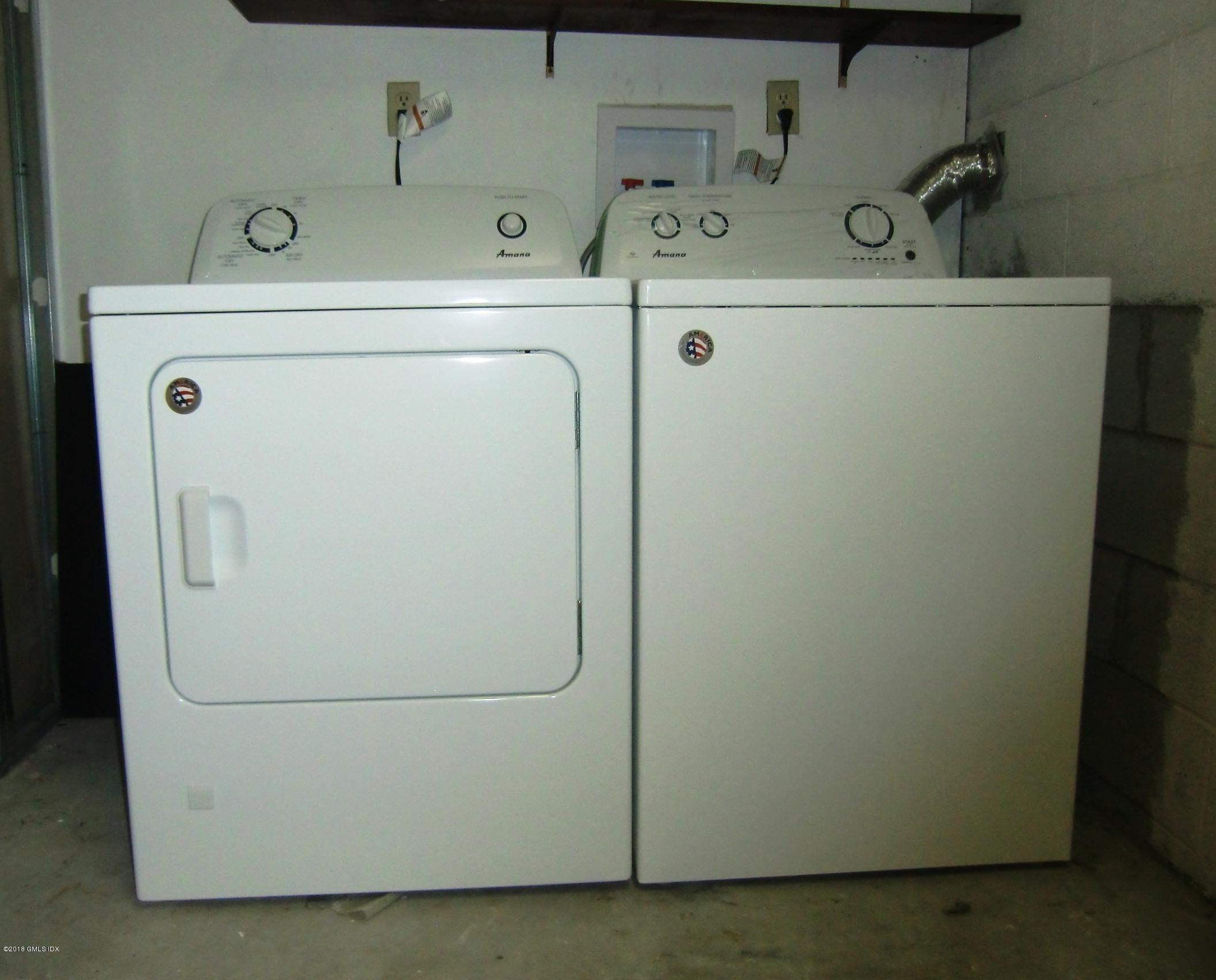 6 Booth Court, Unit B Greenwich, CT 06830 - Photo 6 of 9 a utility room with dryer and washer