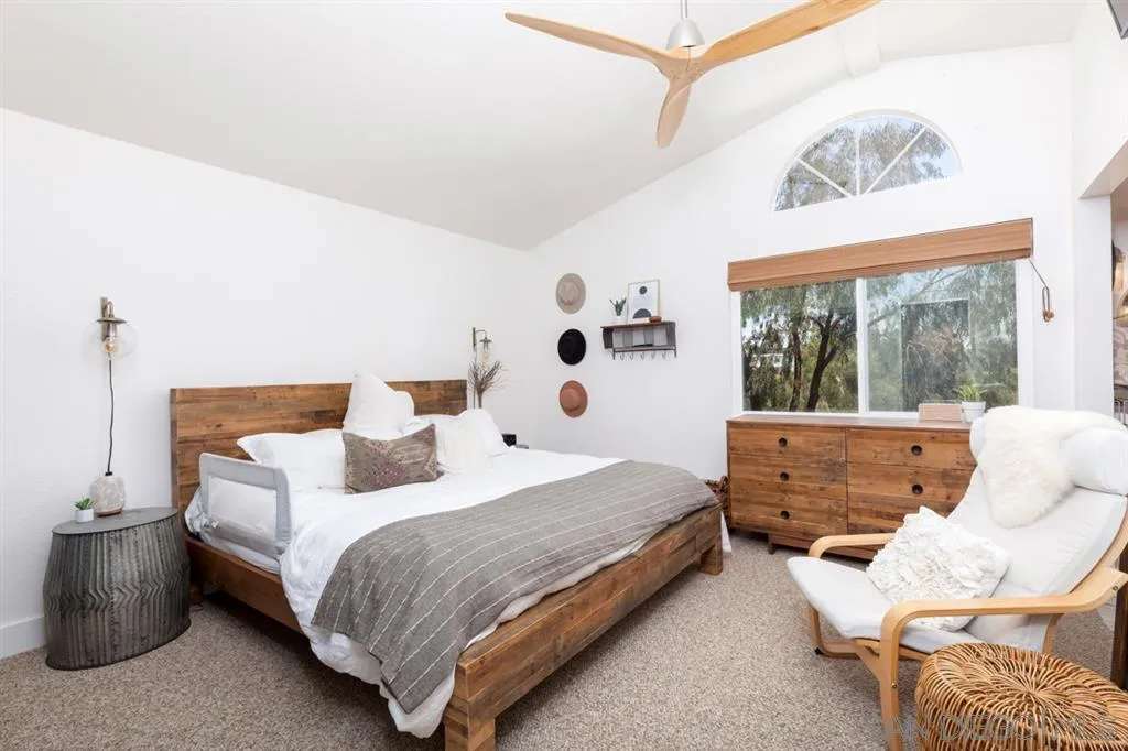 2112 Ramada Drive Oceanside, CA 92056 - Photo 16 of 25 a bedroom with a bed and glass window