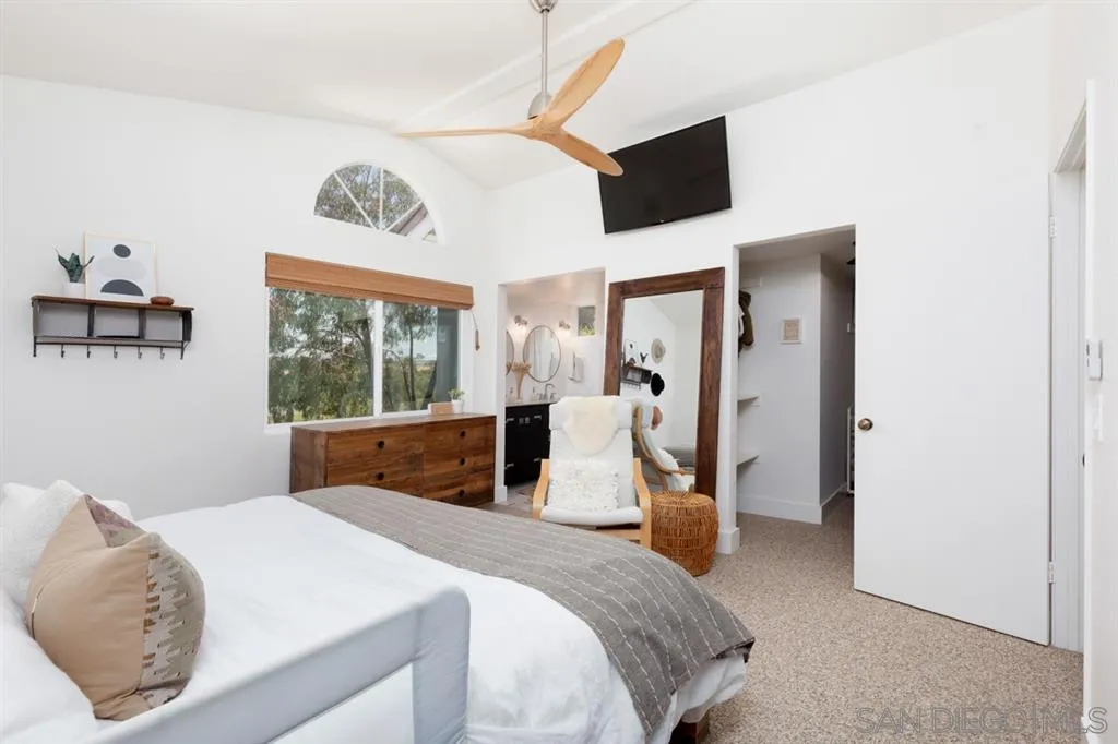 2112 Ramada Drive Oceanside, CA 92056 - Photo 18 of 25 a bedroom with a bed and a flat tv screen