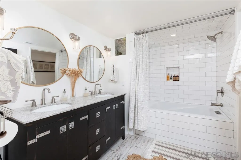 2112 Ramada Drive Oceanside, CA 92056 - Photo 19 of 25 a bathroom with a double vanity sink mirror and shower