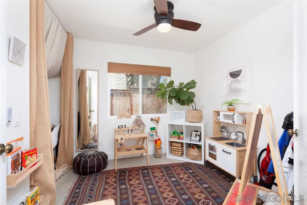 2112 Ramada Drive Oceanside, CA 92056 - Photo 10 of 25 a bed room with a bed and a book shelf