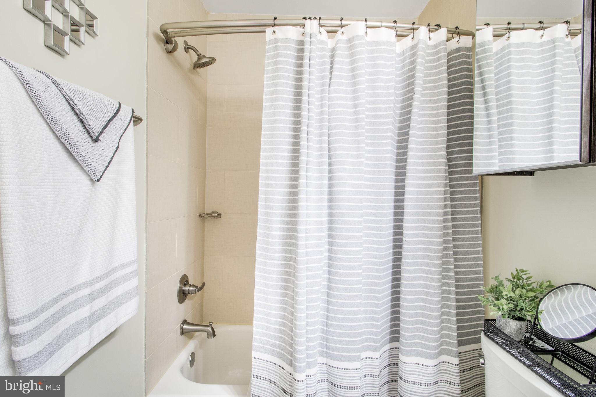 417 18th Street Northeast, Unit 101 Washington, DC 20002 - Photo 22 of 57 a bathroom with a sink and a bathtub