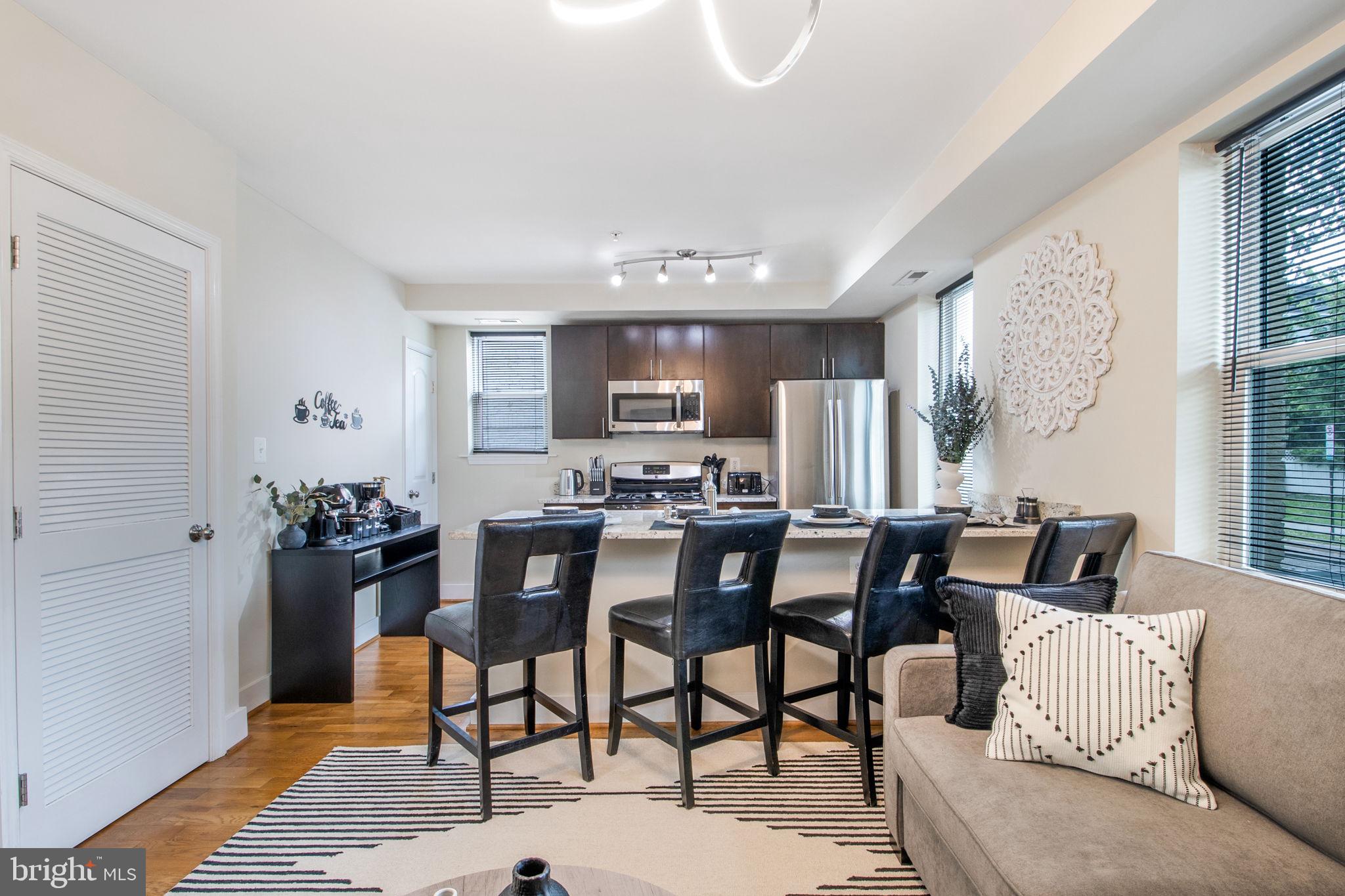 417 18th Street Northeast, Unit 101 Washington, DC 20002 - Photo 24 of 57 a dining room with furniture and window