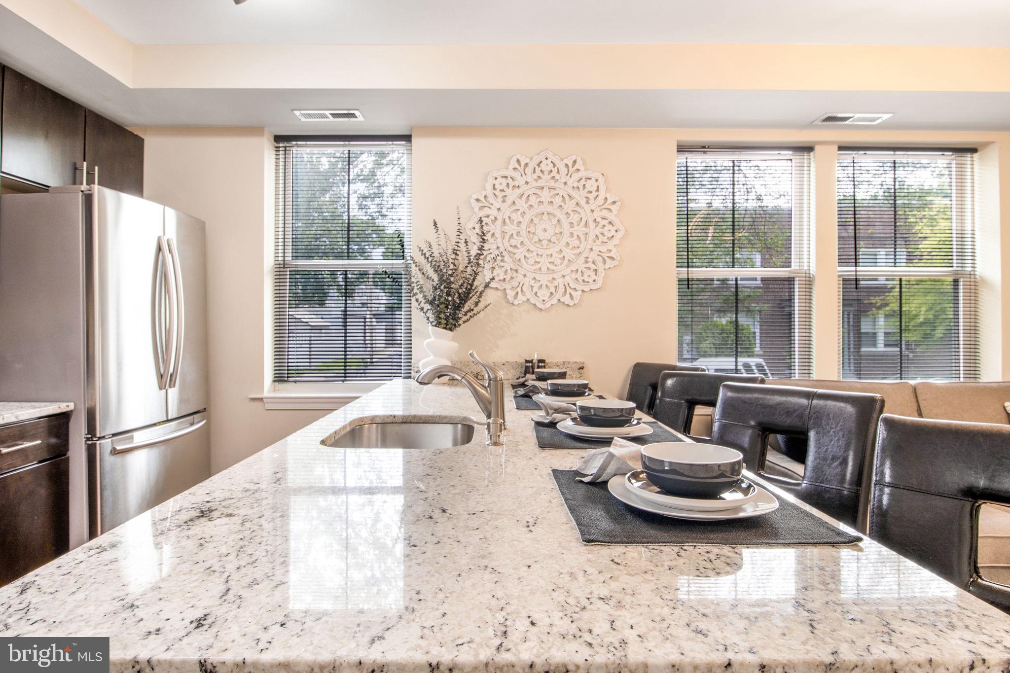 417 18th Street Northeast, Unit 101 Washington, DC 20002 - Photo 28 of 57 a living room with furniture and a large window