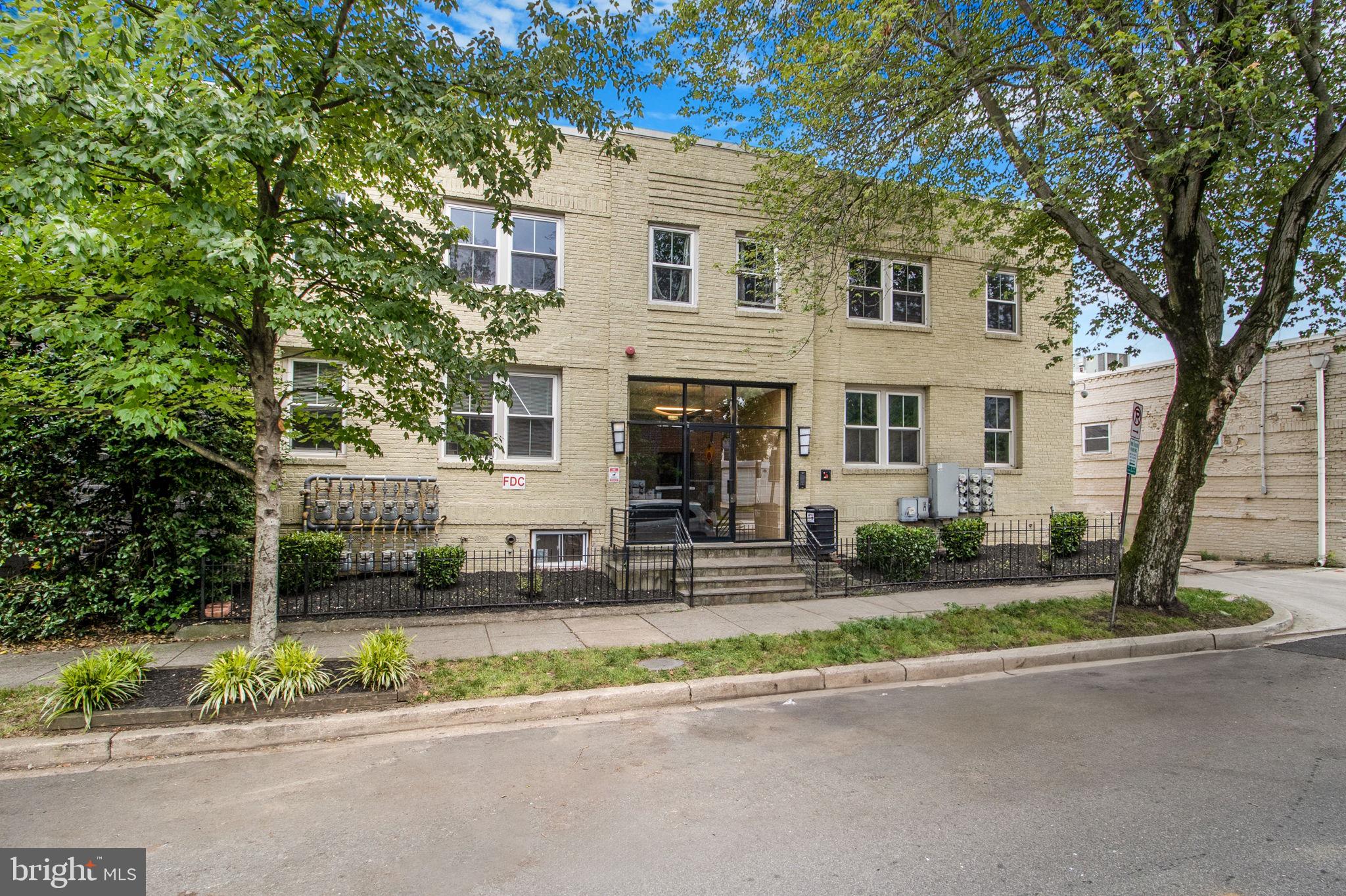 417 18th Street Northeast, Unit 101 Washington, DC 20002 - Photo 3 of 57 front view of a house with a small yard