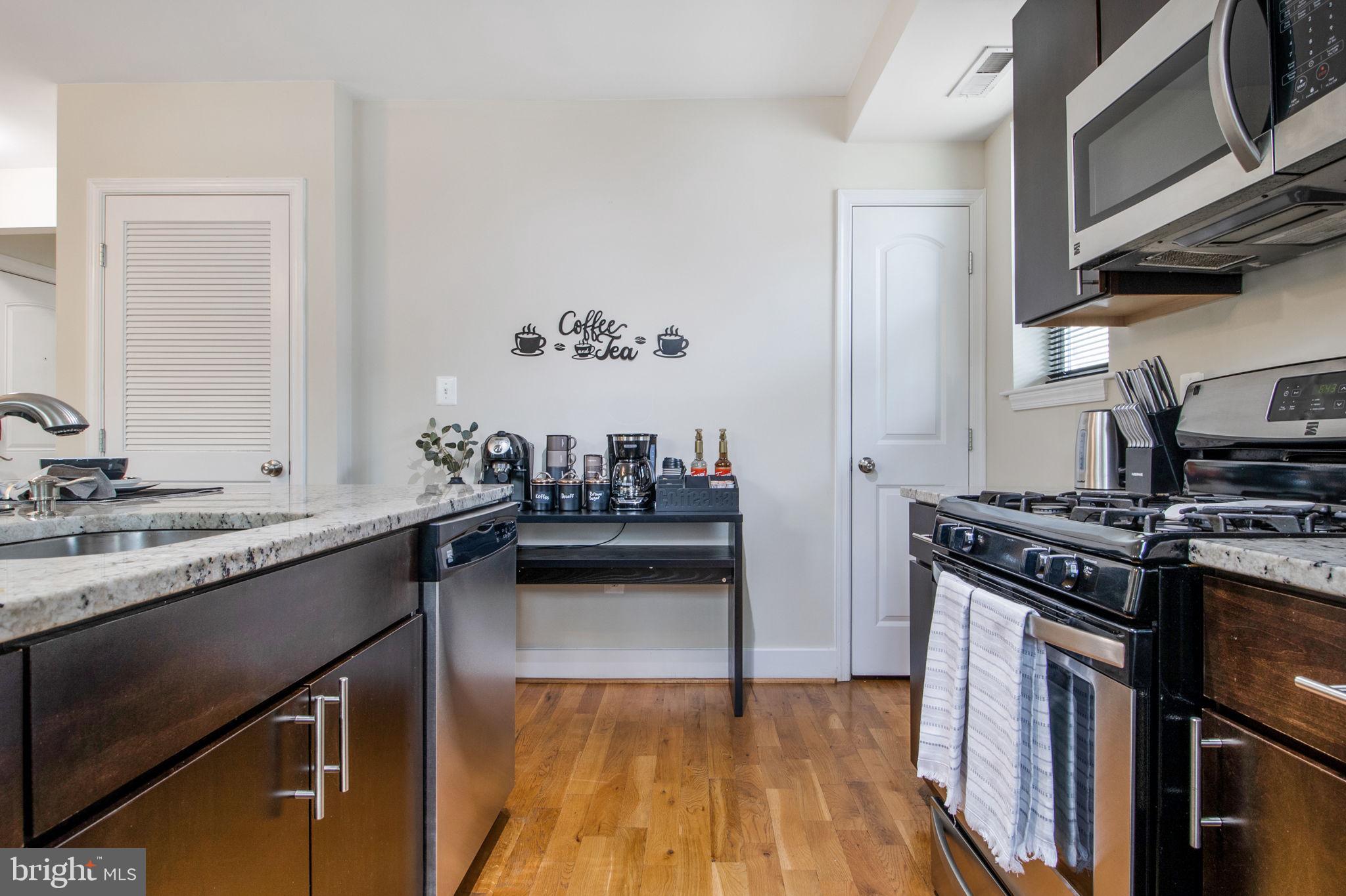 417 18th Street Northeast, Unit 101 Washington, DC 20002 - Photo 31 of 57 a kitchen with a stove and a sink