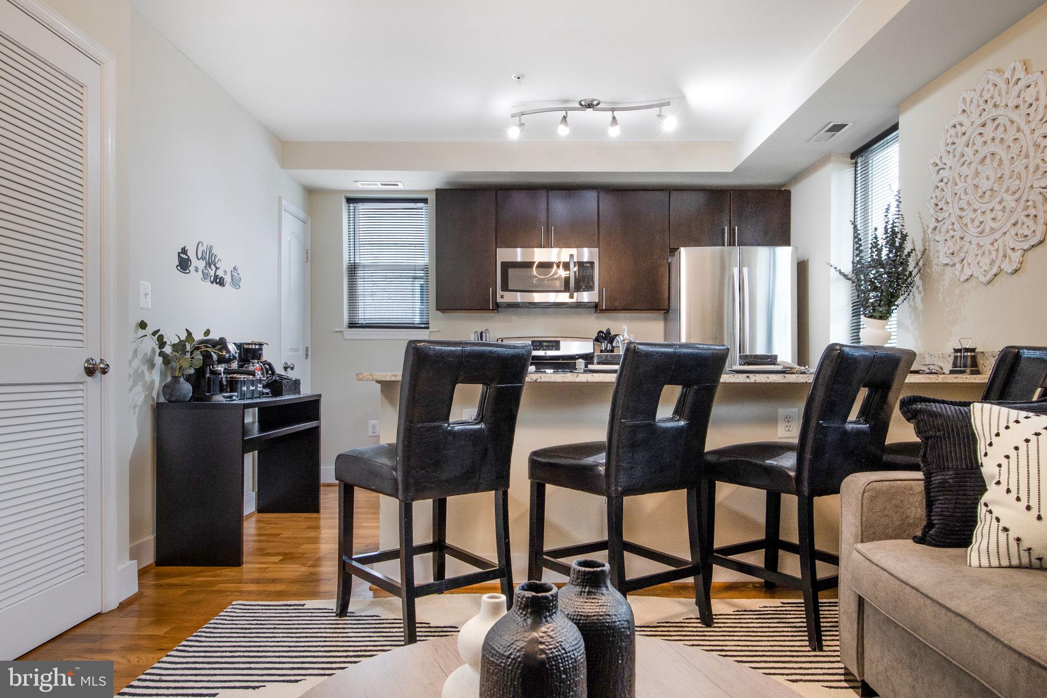 417 18th Street Northeast, Unit 101 Washington, DC 20002 - Photo 40 of 57 a view of a dining room with furniture