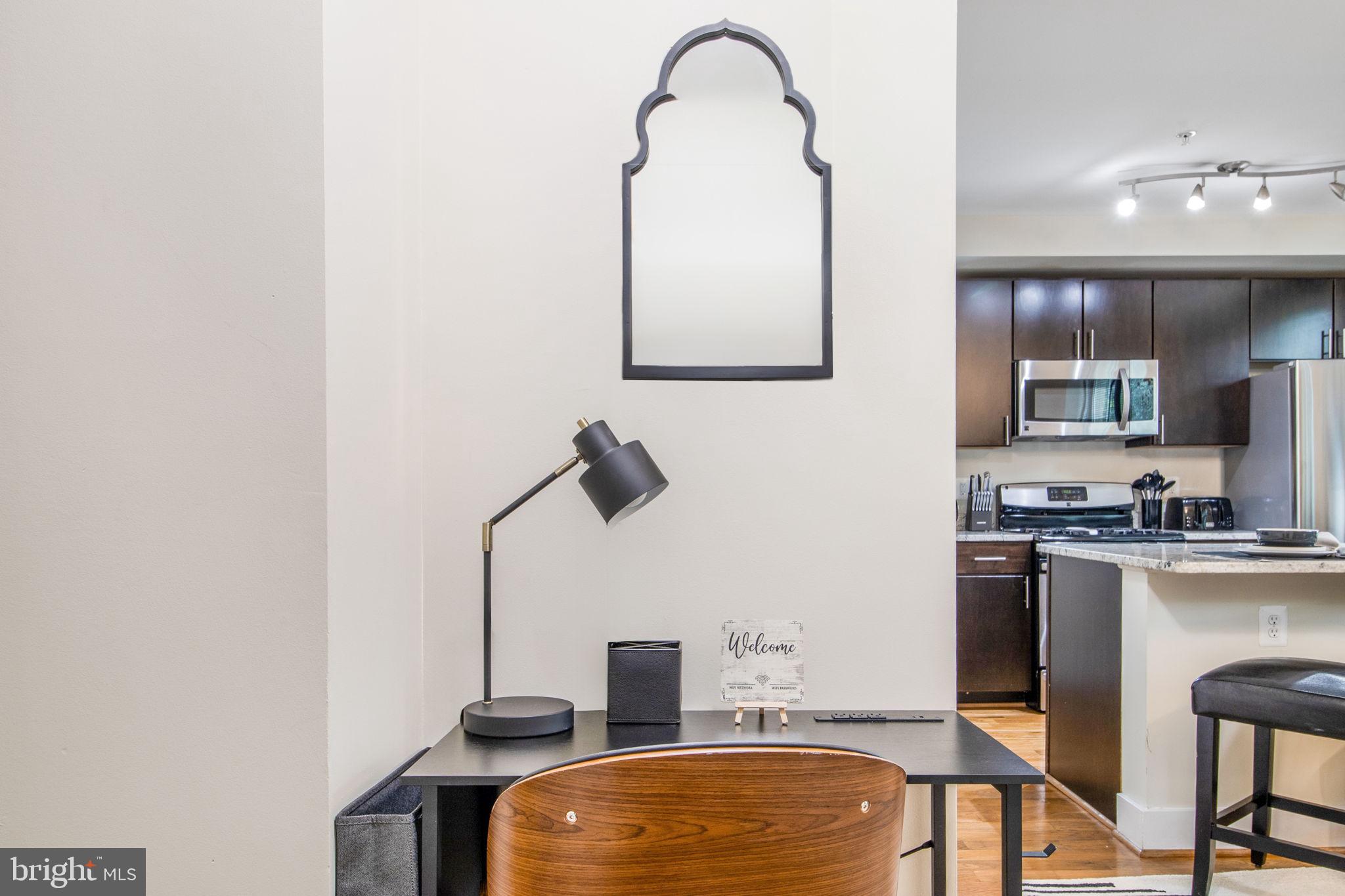 417 18th Street Northeast, Unit 101 Washington, DC 20002 - Photo 43 of 57 a room with furniture a mirror and white walls