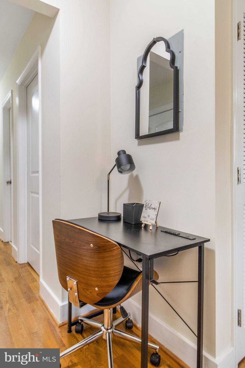 417 18th Street Northeast, Unit 101 Washington, DC 20002 - Photo 45 of 57 a view of a workspace room with wooden floor