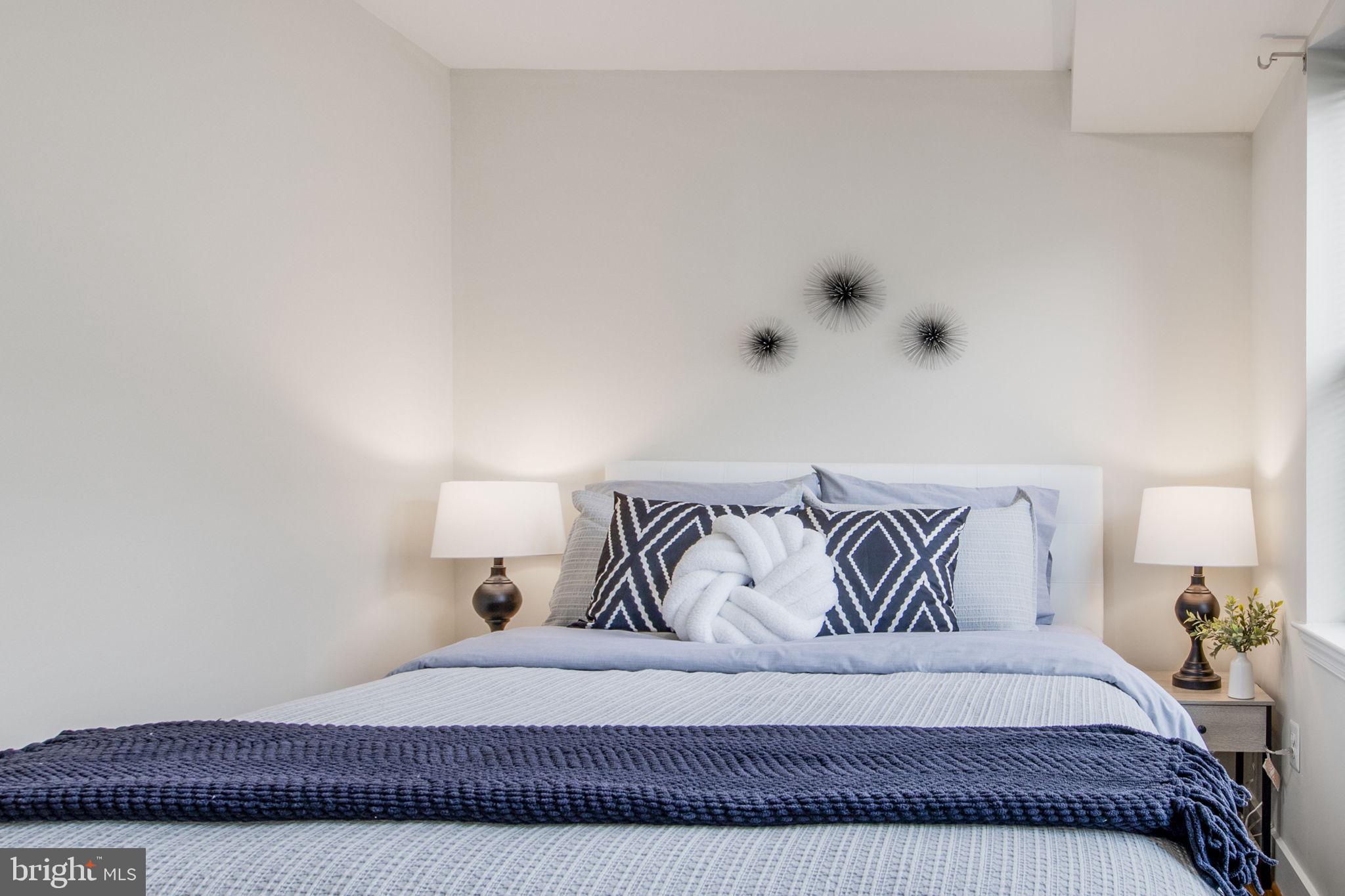 417 18th Street Northeast, Unit 101 Washington, DC 20002 - Photo 5 of 57 a bedroom with a bed and window