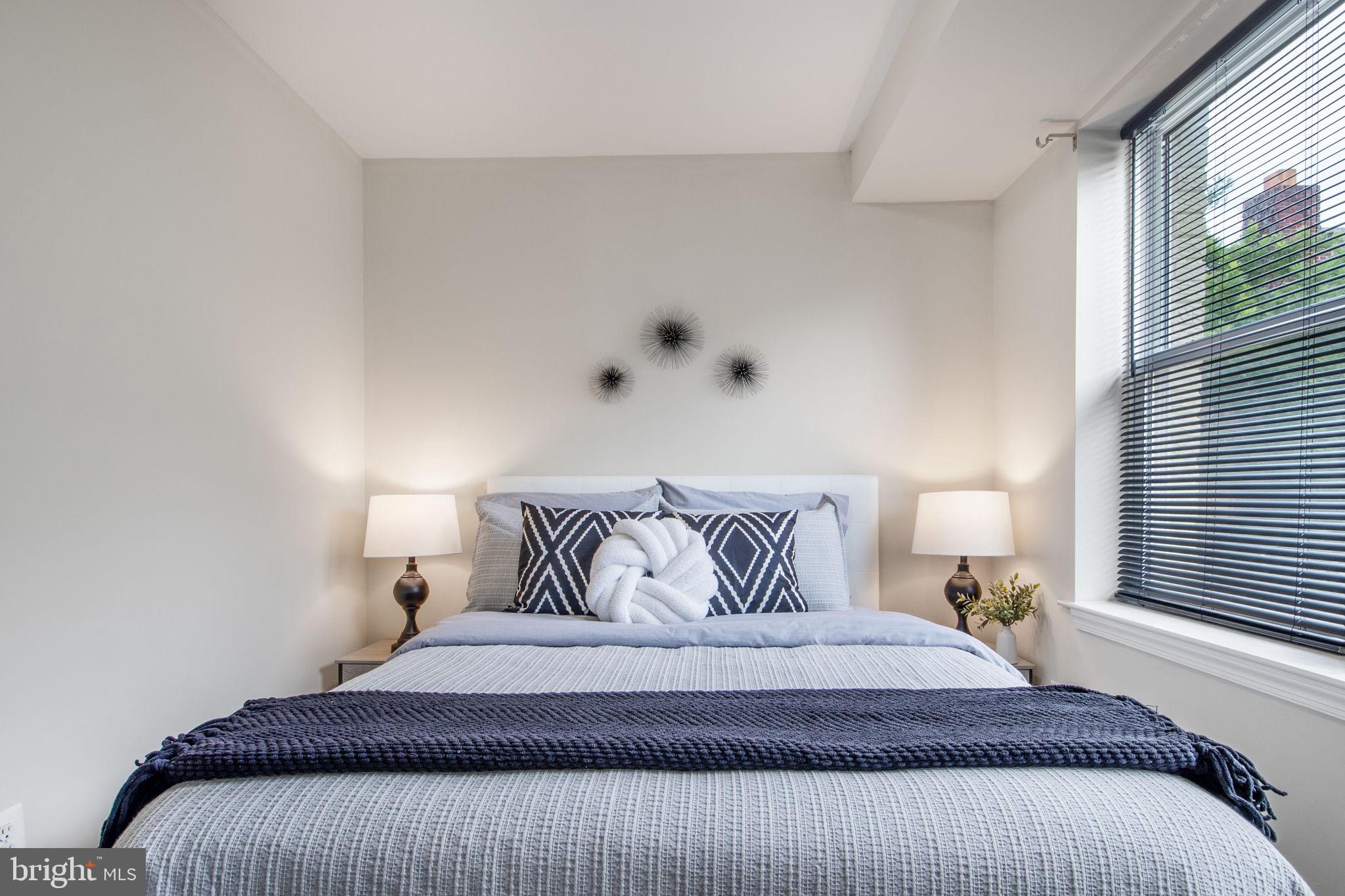 417 18th Street Northeast, Unit 101 Washington, DC 20002 - Photo 6 of 57 a bedroom with a bed and window