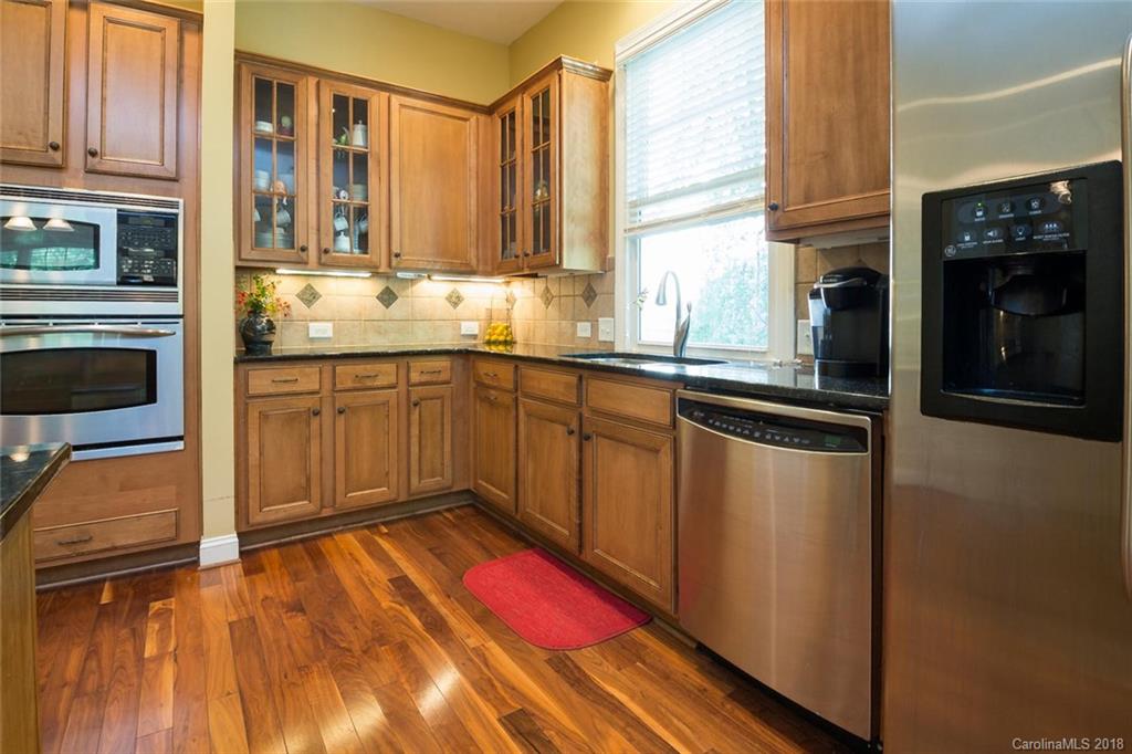 912 Gardenia Street Fort Mill, SC 29708 - Photo 12 of 32 a kitchen with stainless steel appliances granite countertop a refrigerator and a stove top oven