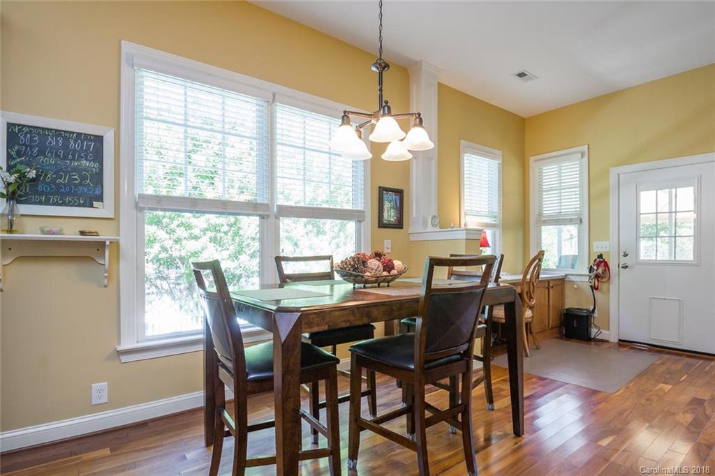 912 Gardenia Street Fort Mill, SC 29708 - Photo 15 of 32 a view of a dining room with furniture and chandelier