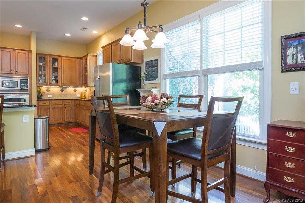 912 Gardenia Street Fort Mill, SC 29708 - Photo 16 of 32 a view of a dining room with furniture window and wooden floor