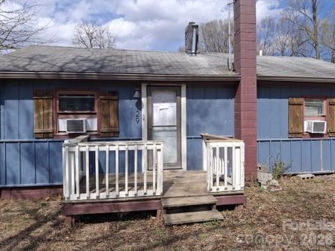 129 Harrison Street Swannanoa, NC 28778 - Photo 10 of 17 a view of a house with wooden deck and furniture