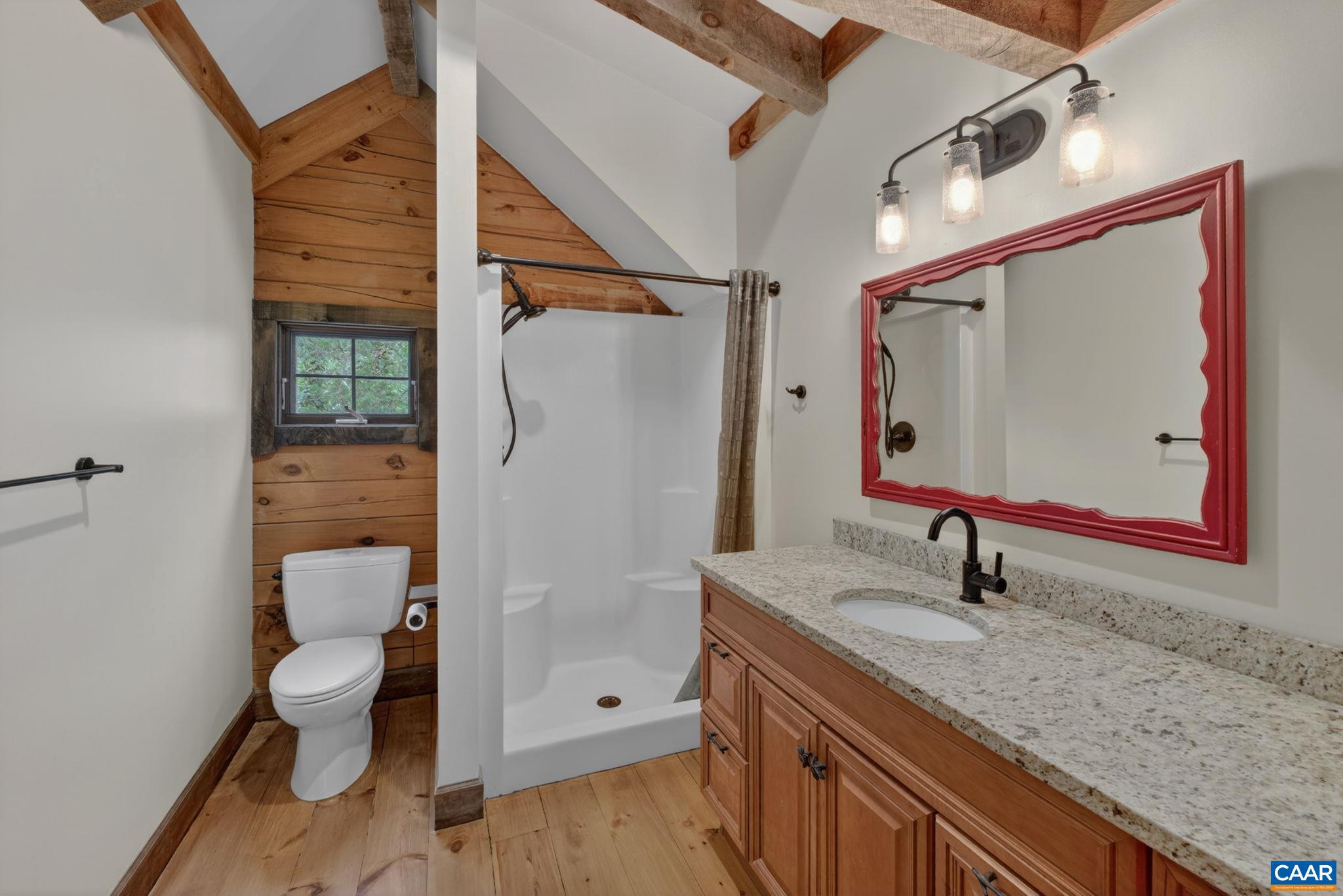 101 Greene Acres Road South Stanardsville, VA 22973 - Photo 22 of 52 a bathroom with a toilet sink and shower