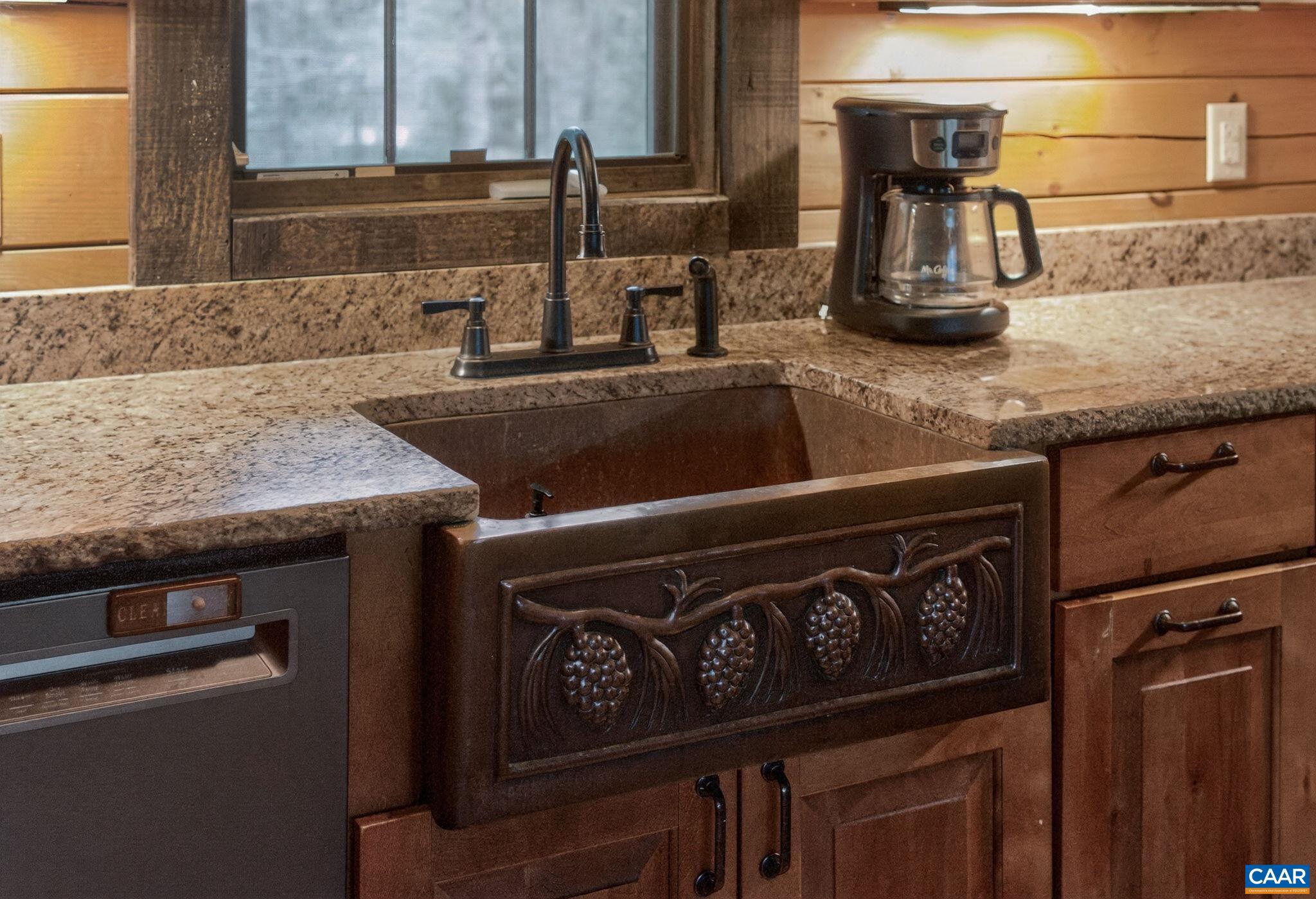 101 Greene Acres Road South Stanardsville, VA 22973 - Photo 28 of 52 a kitchen with granite countertop a sink and a stove