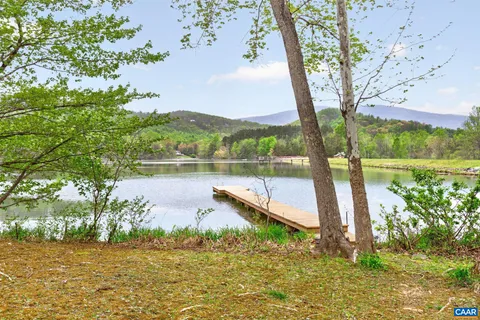a view of a lake in between the city and lake