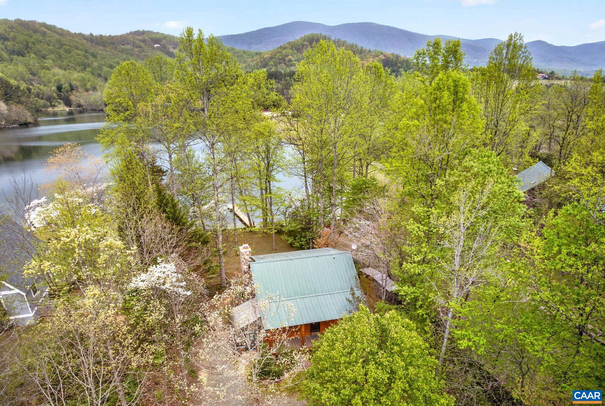 101 Greene Acres Road South Stanardsville, VA 22973 - Photo 4 of 52 a view of a lake with a mountain in the background