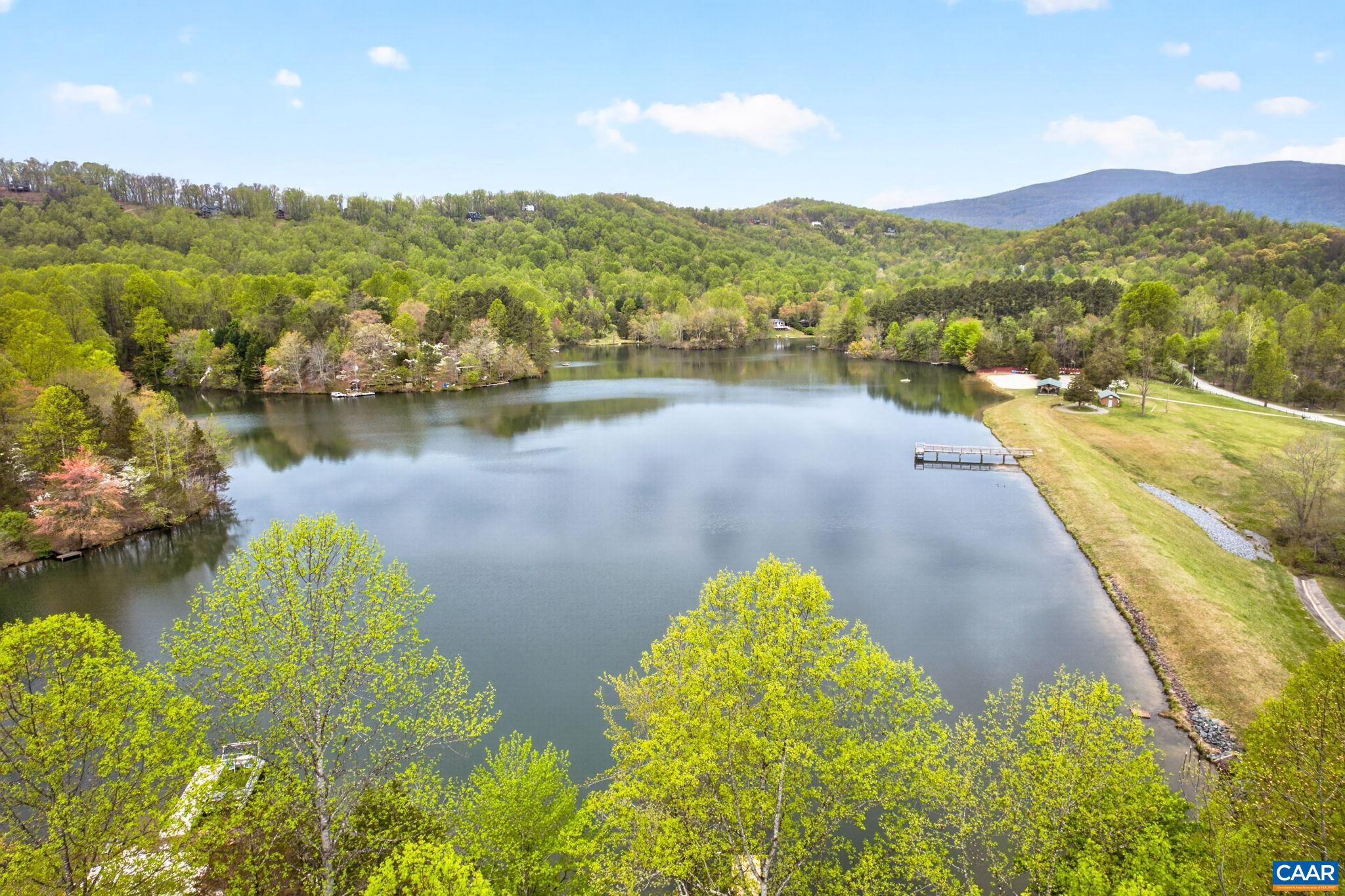 101 Greene Acres Road South Stanardsville, VA 22973 - Photo 44 of 52 a view of a lake with a mountain in the background