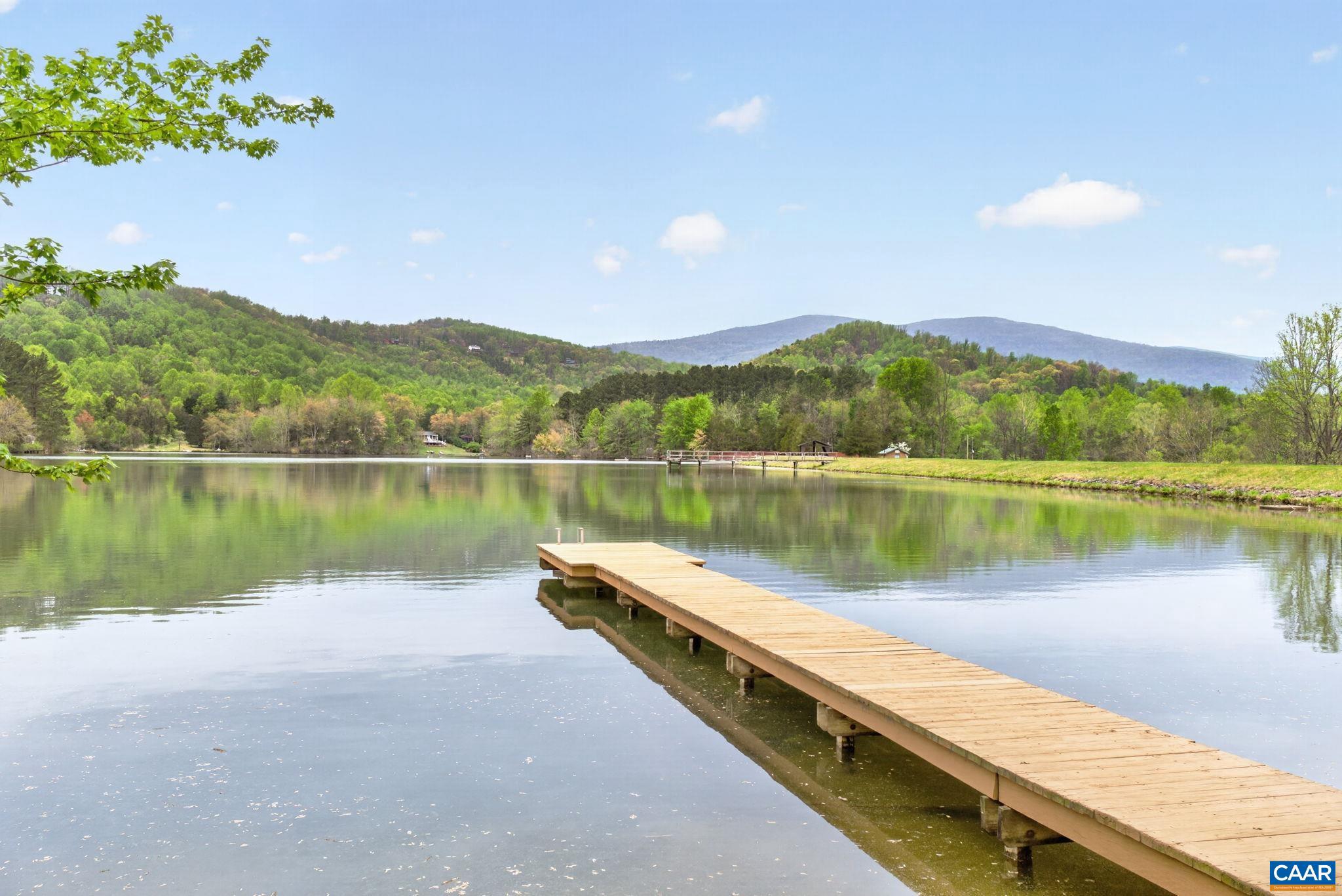 101 Greene Acres Road South Stanardsville, VA 22973 - Photo 5 of 52 a view of a lake with a mountain