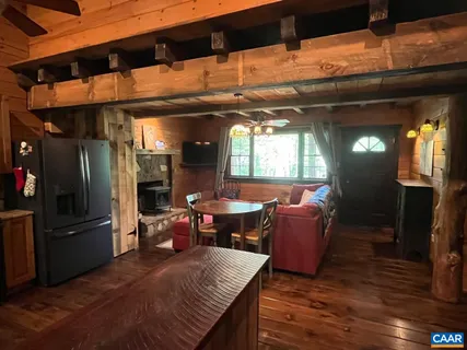 a kitchen with lots of counter top space and wooden floor