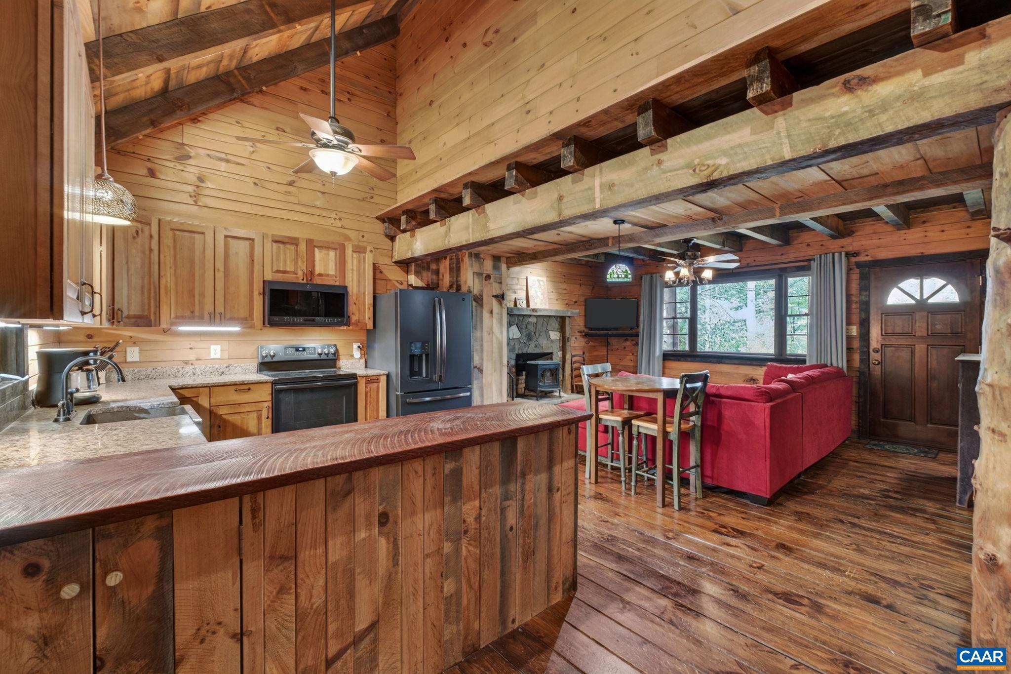 101 Greene Acres Road South Stanardsville, VA 22973 - Photo 7 of 52 a kitchen with lots of counter top space and wooden floor